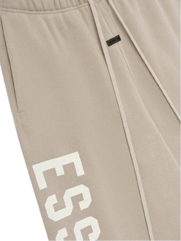 FEAR OF GOD ESSENTIALS TIMBER LOUNGE FLEECE BAGGY SWEATPANTS ESSENTIALS The Hype Company
