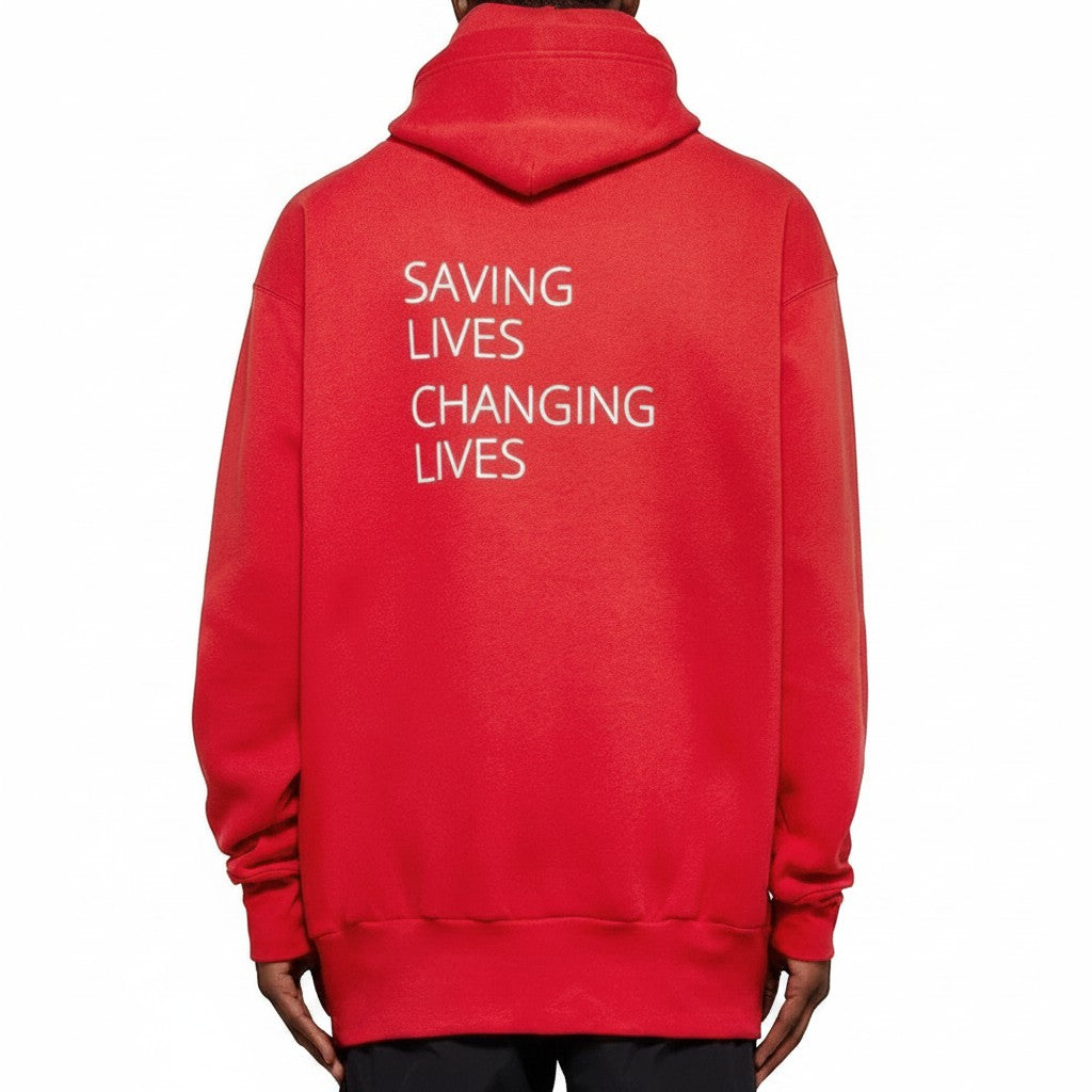 The Hype Company sudadera roja BALENCIAGA WFP con texto blanco 'SAVING LIVES CHANGING LIVES' en la espalda.