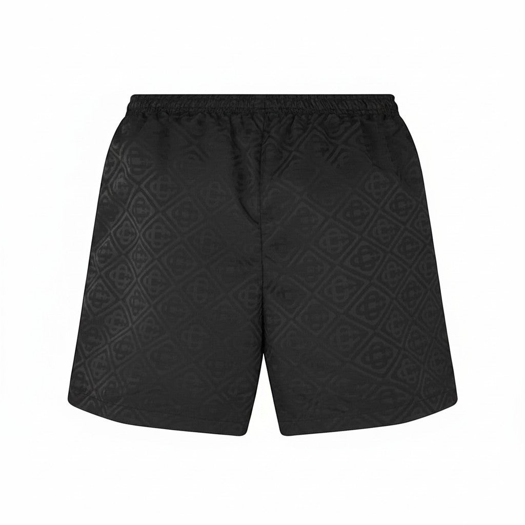 Bañador negro con estampado de monograma de The Hype Company, diseño corto con cintura elástica.