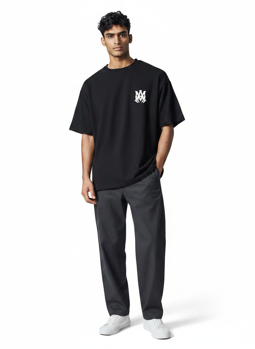 The Hype Company black cotton t-shirt with white Amiri logo on chest, short sleeves, crew neck.