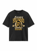Camiseta negra The Hype Company con estampado gráfico de león y letras doradas estilo universitario