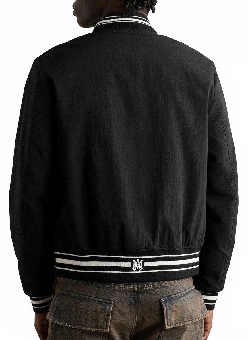 Chaqueta bomber negra de nailon AMIRI 22 con logo desgastado y detalles a rayas en The Hype Company