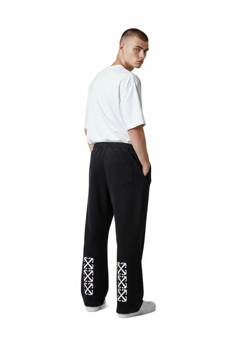Pantalones de chándal negros The Hype Company con estampado de flechas blancas en la parte inferior de las piernas