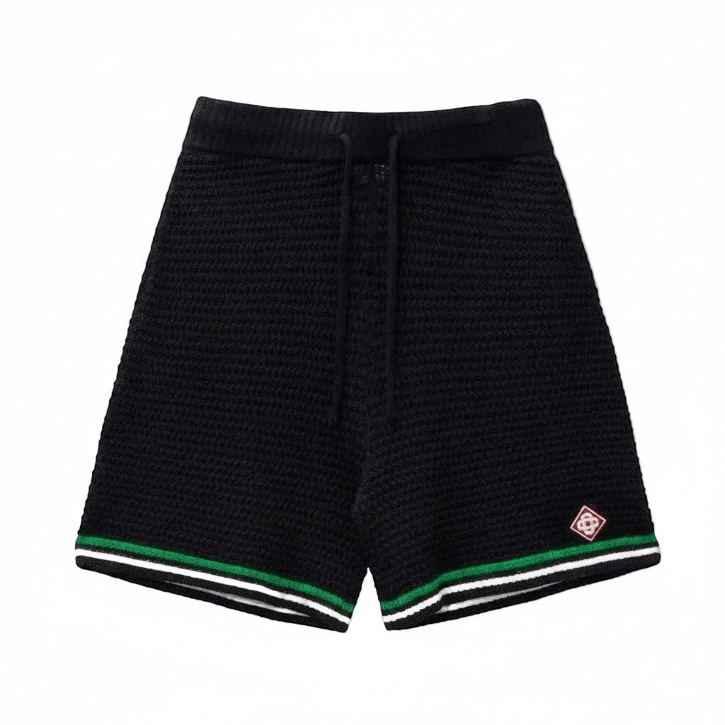 The Hype Company pantalones cortos de crochet negros con cordón y detalles de rayas verdes y blancas en el dobladillo.