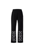 Pantalones negros The Hype Company con estampado de flechas estilo bandana en blanco en la parte inferior de las piernas