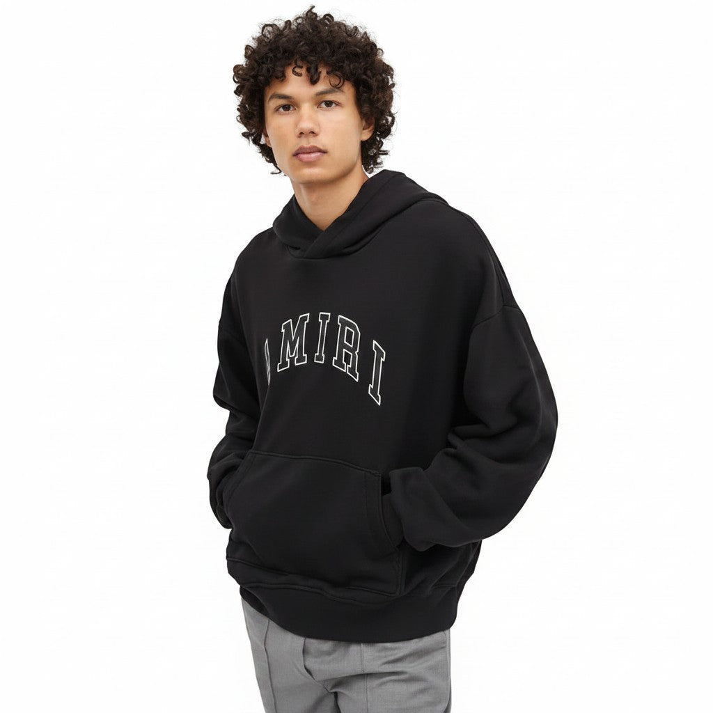 The Hype Company sudadera negra con capucha de algodón con logo AMIRI de cuero en contraste y bolsillo canguro.