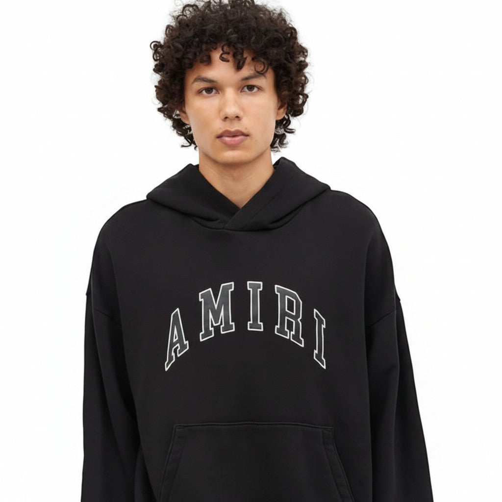 The Hype Company sudadera con capucha negra de algodón con logo de arco de cuero AMIRI y bolsillo canguro.